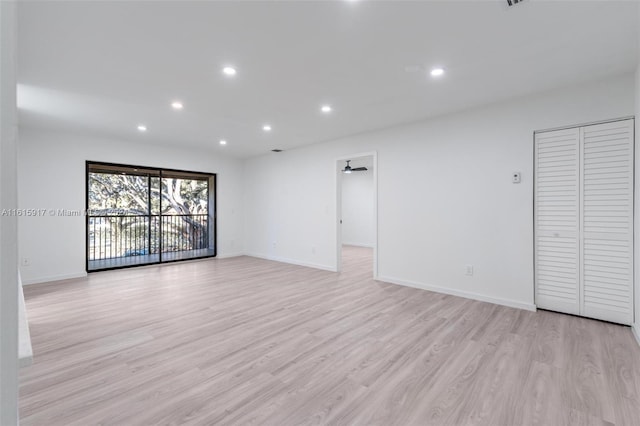 unfurnished room with light hardwood / wood-style floors and ceiling fan