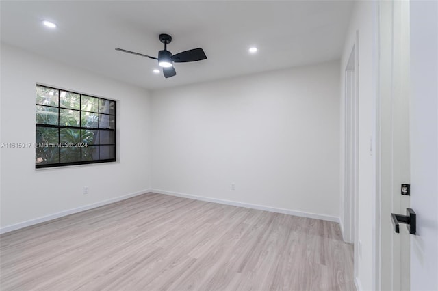 unfurnished room featuring ceiling fan and light wood-type flooring