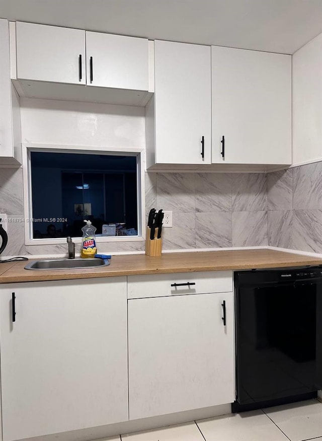 bar with backsplash, white cabinetry, dishwasher, and light tile patterned flooring