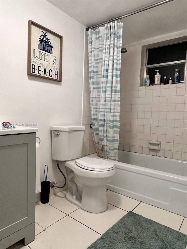 full bathroom featuring tile patterned floors, toilet, shower / tub combo, and vanity