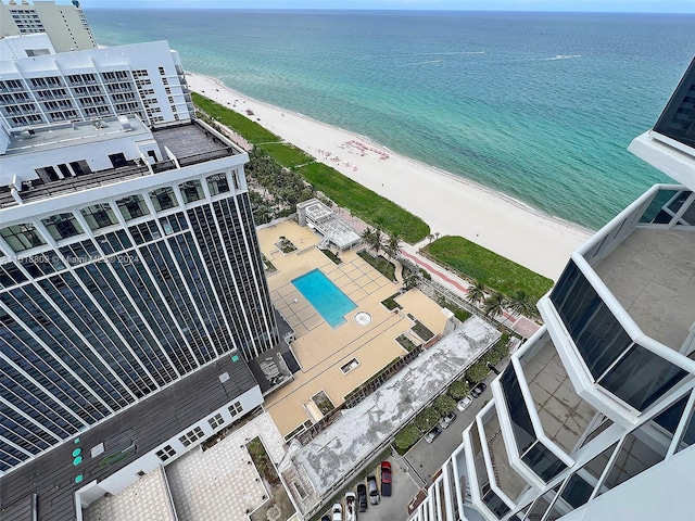 bird's eye view featuring a beach view and a water view