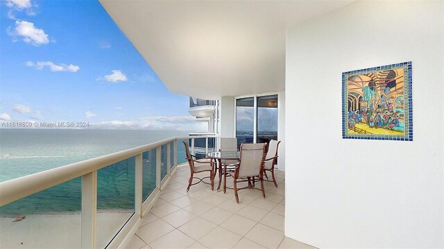 balcony featuring a water view