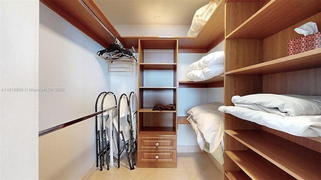 walk in closet featuring light tile patterned floors