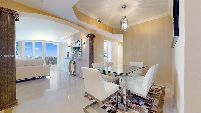 dining room with arched walkways, ornamental molding, and visible vents