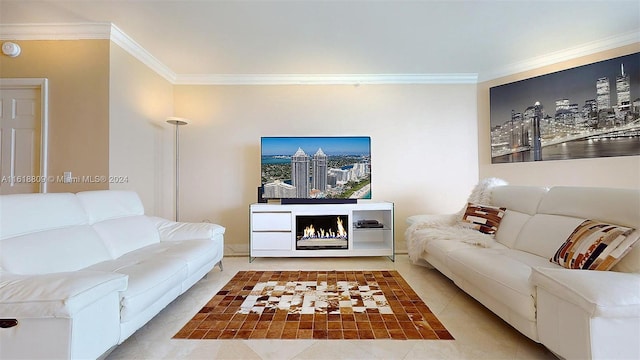 living room with crown molding, a warm lit fireplace, and tile patterned flooring
