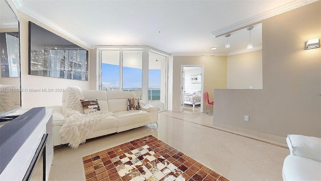 tiled living area featuring crown molding and baseboards