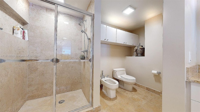 bathroom with tile patterned floors, a bidet, a shower with shower door, and toilet