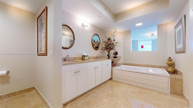 bathroom featuring a garden tub, a sink, and double vanity
