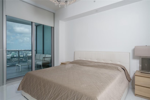 tiled bedroom featuring access to exterior and a wall of windows