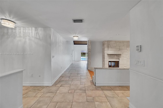 hallway with light tile patterned floors