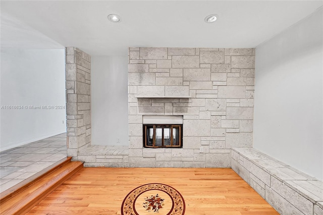 unfurnished living room with wood-type flooring