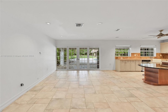 interior space with ceiling fan, light tile patterned floors, and french doors