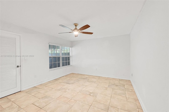 unfurnished room with ceiling fan