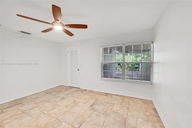 unfurnished room featuring ceiling fan