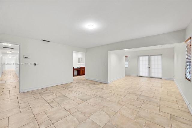 spare room featuring french doors