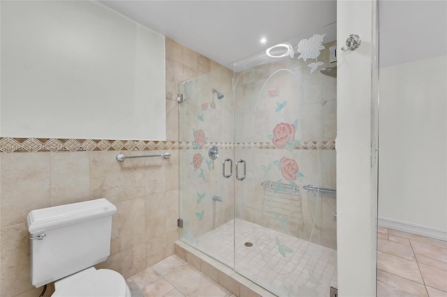 bathroom featuring toilet, tile patterned flooring, tile walls, and walk in shower