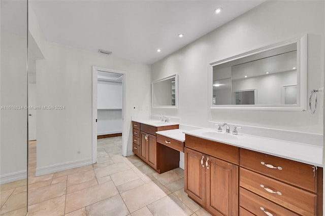 bathroom with tile patterned flooring and vanity