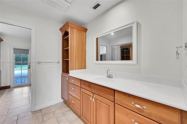 bathroom featuring tile patterned flooring and vanity