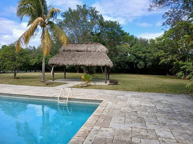 view of pool featuring a gazebo, a patio area, and a yard