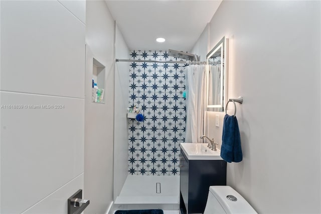 bathroom with vanity, tile patterned flooring, a shower with shower curtain, and toilet