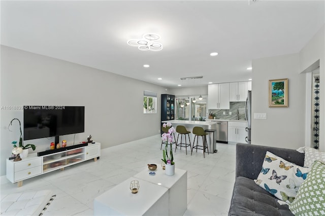 living room with light tile patterned floors