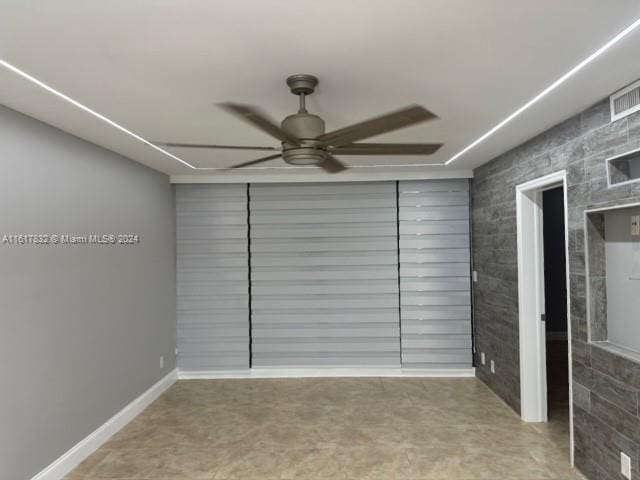 spare room featuring ceiling fan