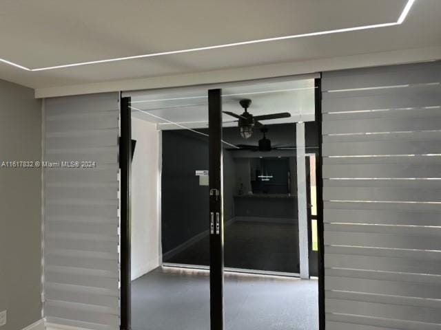 entrance to property featuring ceiling fan