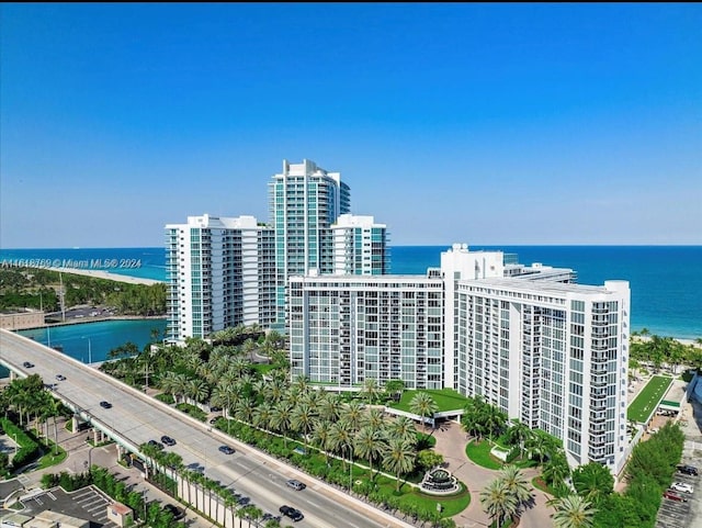 birds eye view of property with a water view