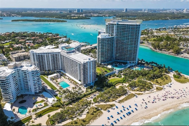 drone / aerial view featuring a city view and a water view