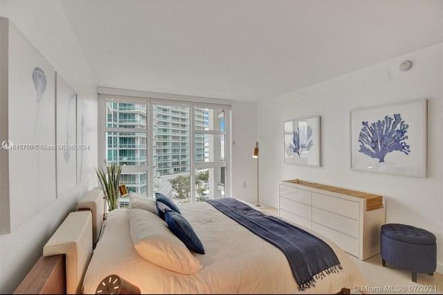 bedroom featuring floor to ceiling windows