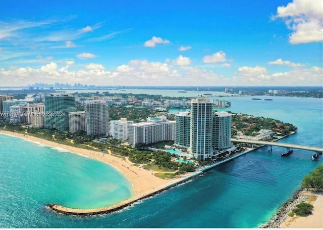 bird's eye view with a beach view and a water view