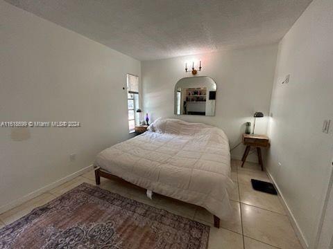 bedroom with tile patterned floors