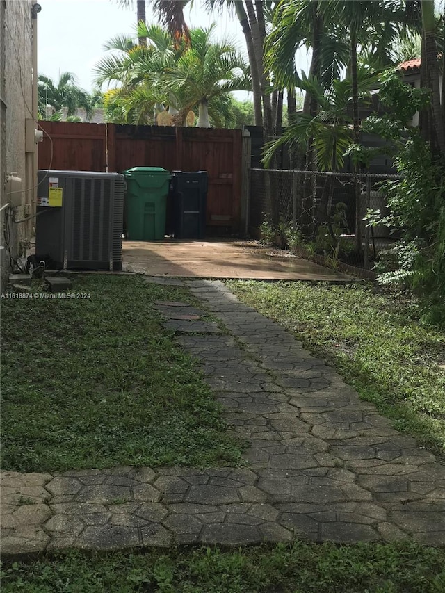 view of yard featuring central air condition unit