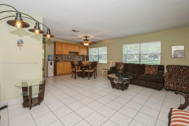 tiled living room featuring ceiling fan