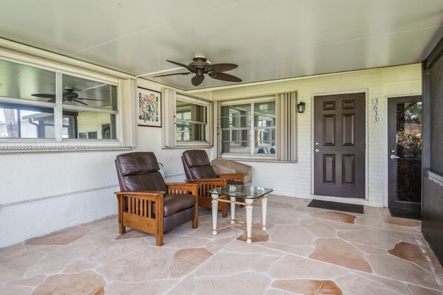 sunroom / solarium with ceiling fan