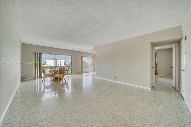 spare room featuring a textured ceiling