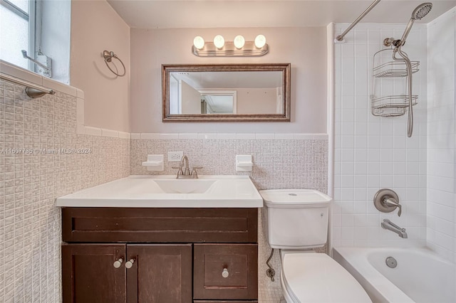 full bathroom with vanity, toilet, decorative backsplash, and tile walls