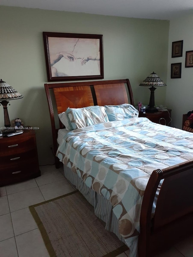 bedroom featuring light tile patterned flooring