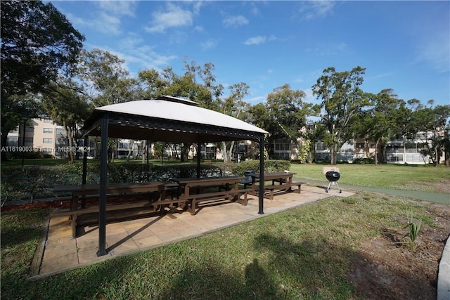 view of property's community with a gazebo and a yard