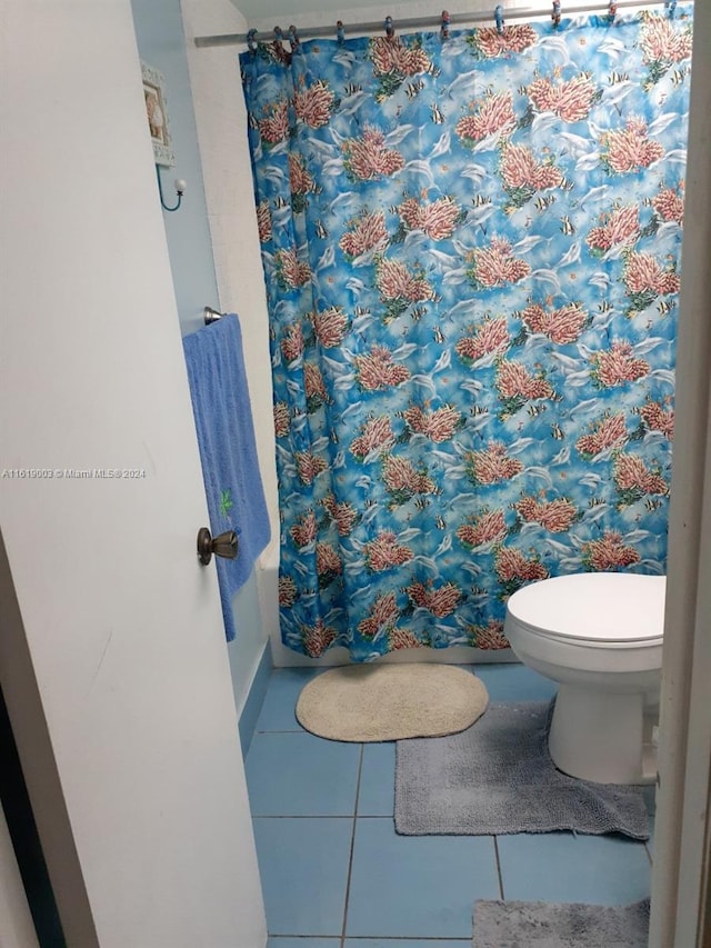 bathroom with tile patterned floors and toilet