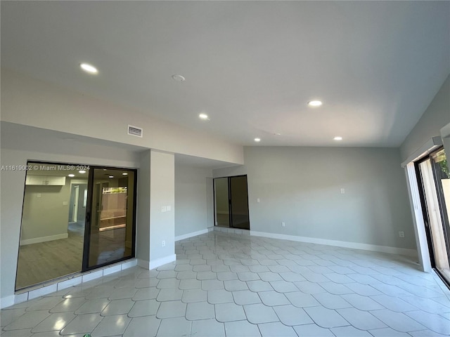 empty room with tile patterned flooring