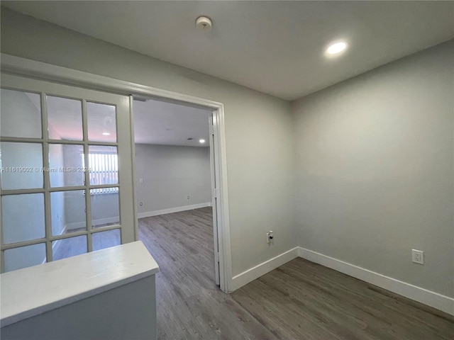 spare room with wood-type flooring