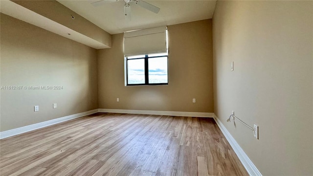 spare room featuring ceiling fan and light wood-type flooring