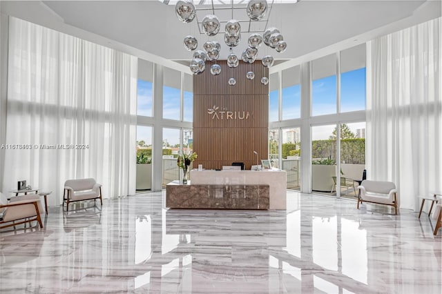 welcome area featuring a chandelier