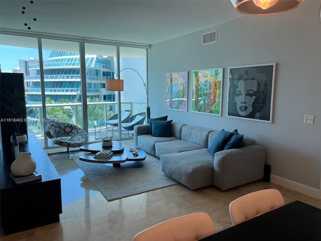 living room featuring a wall of windows