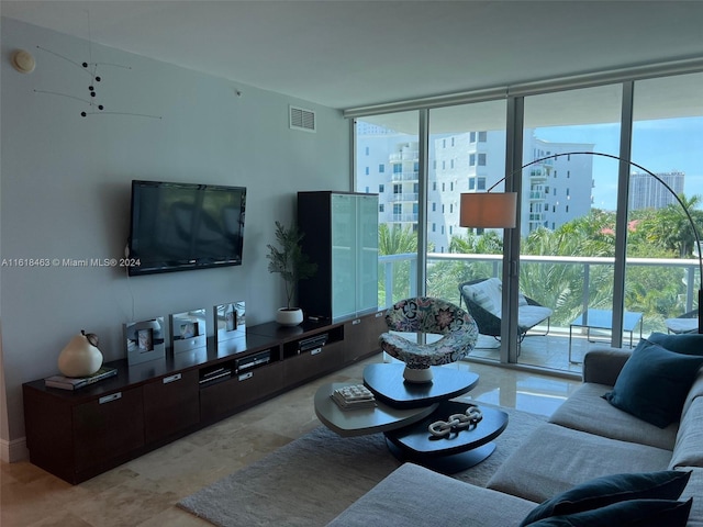 living room featuring a wall of windows