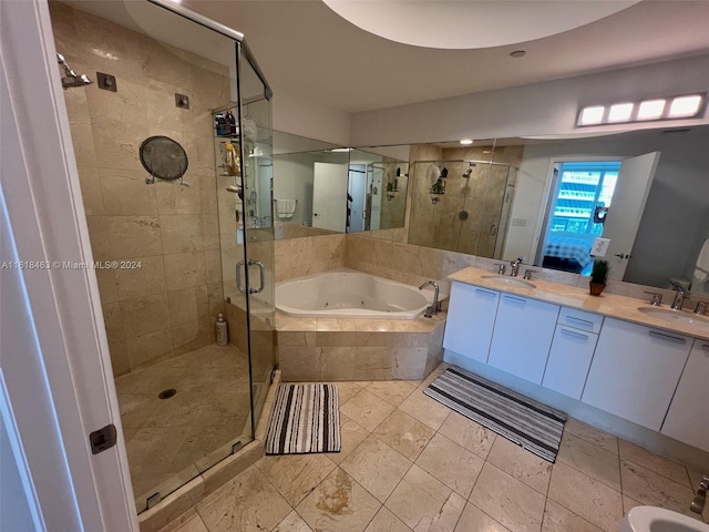 bathroom with separate shower and tub and vanity