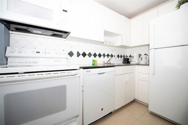 kitchen featuring white cabinets, white appliances, and light tile patterned floors