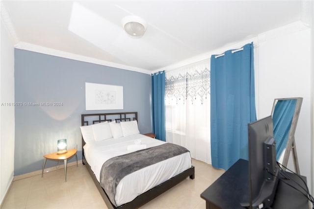 bedroom featuring crown molding