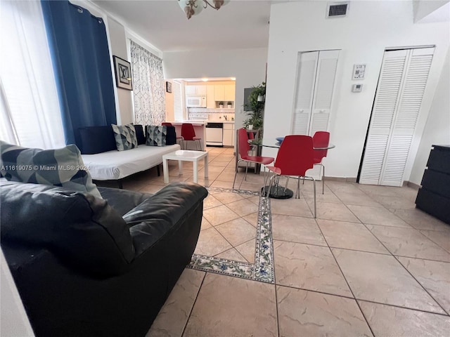 living room with light tile patterned flooring